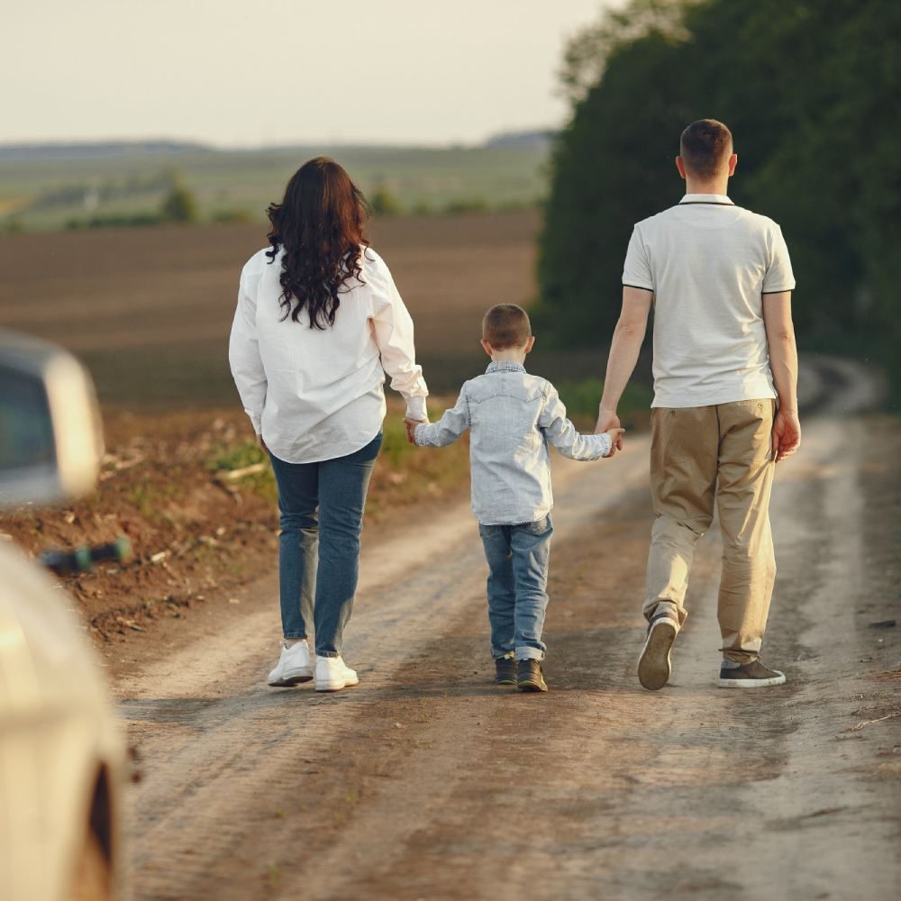 Cute family playing in a summer field
