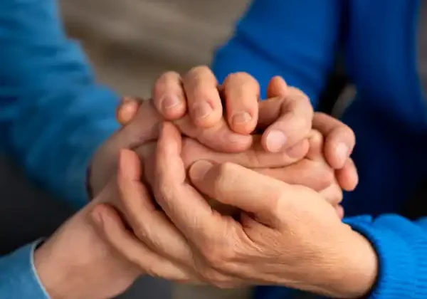 York Funeral Services people-holding-hand-in-support